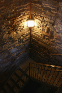 Image of dark stairwell lit by a single light