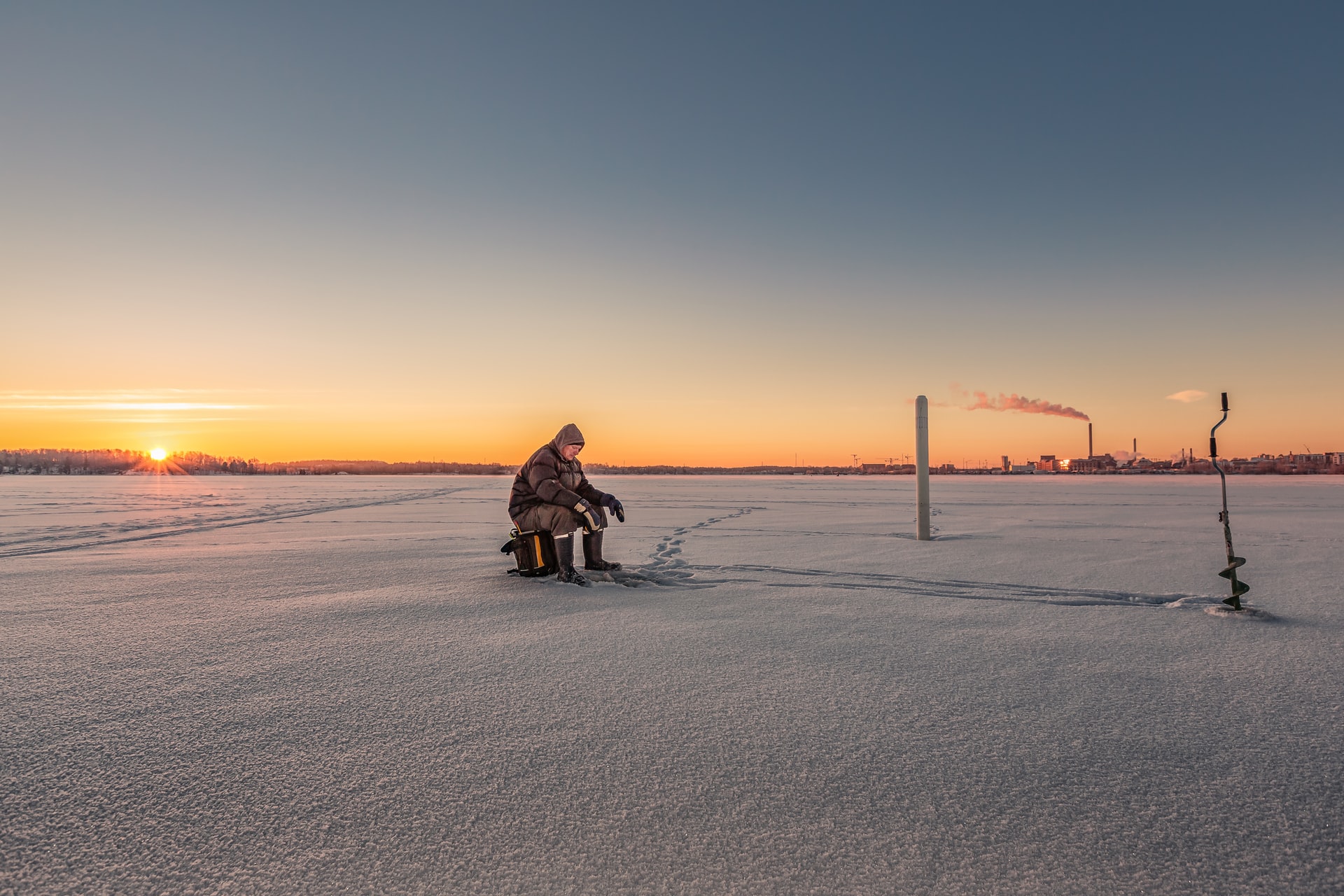 Image of ice fisher all alone—Photo by Carlos "Grury" Santos on Unsplash