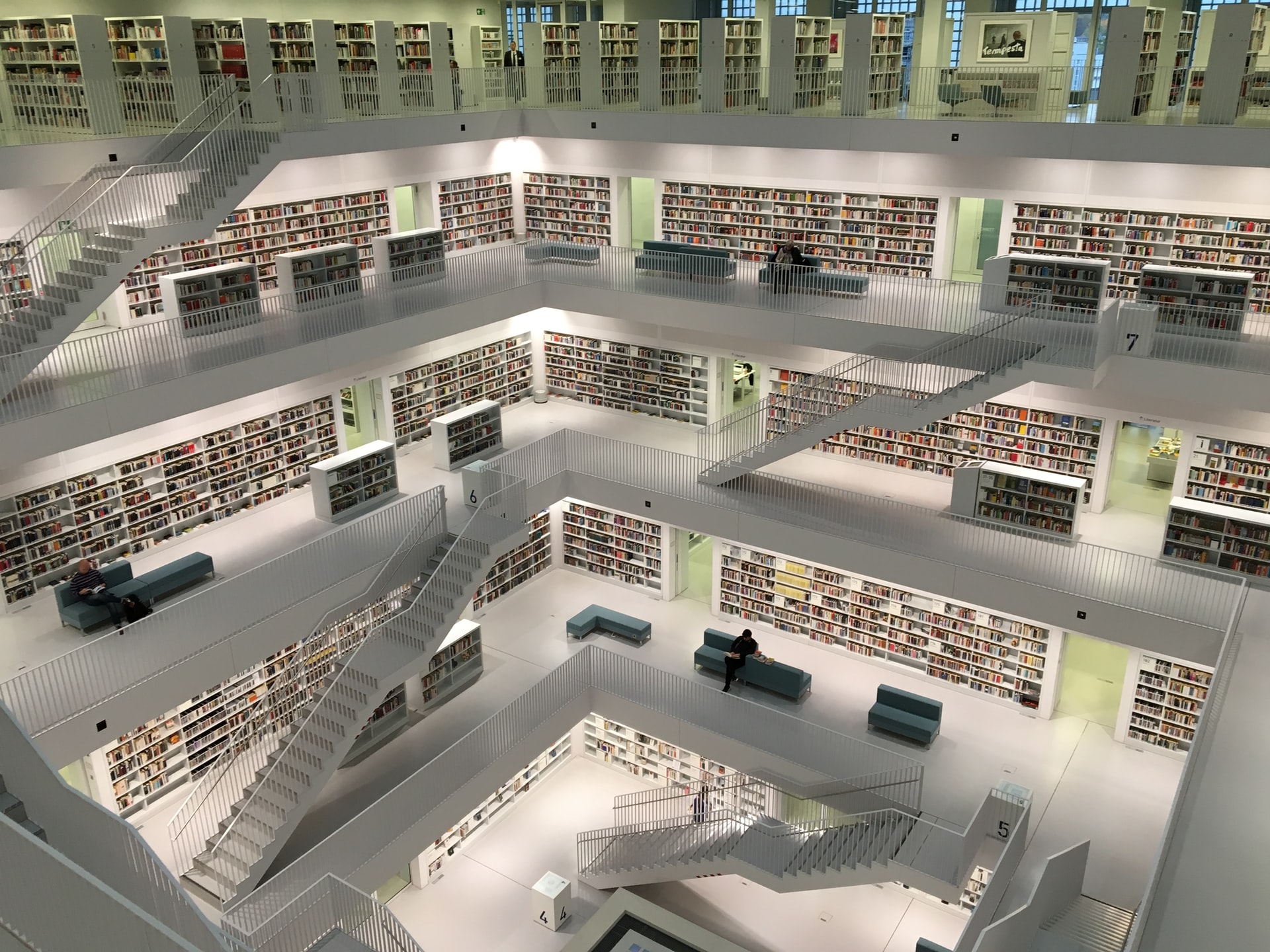 Photo of 5 story library inside looking down by Tobias Fischer on Unsplash