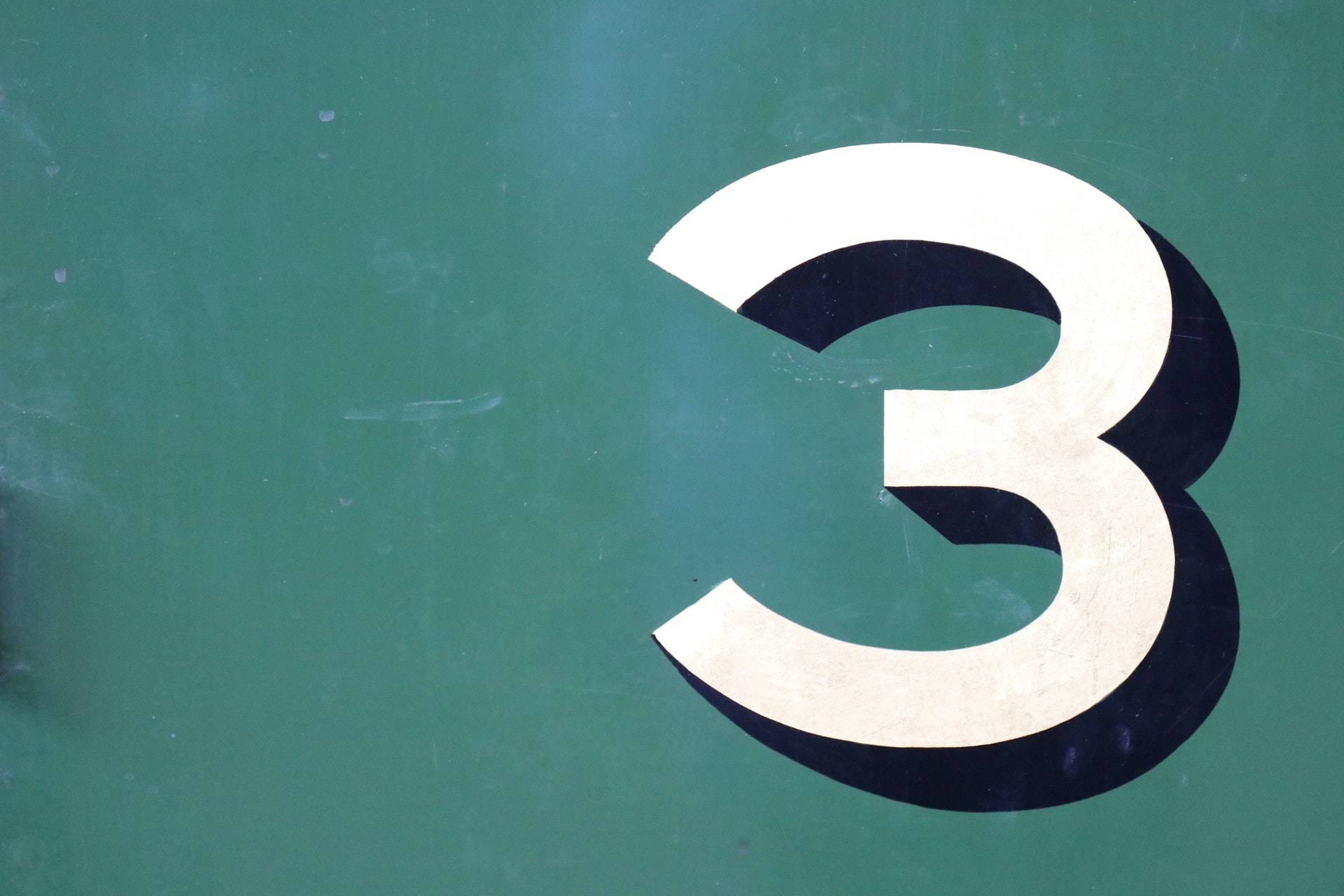 Photo of "3" sign by Tony Hand on Unsplash
